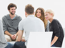 a group of people sitting in a circle